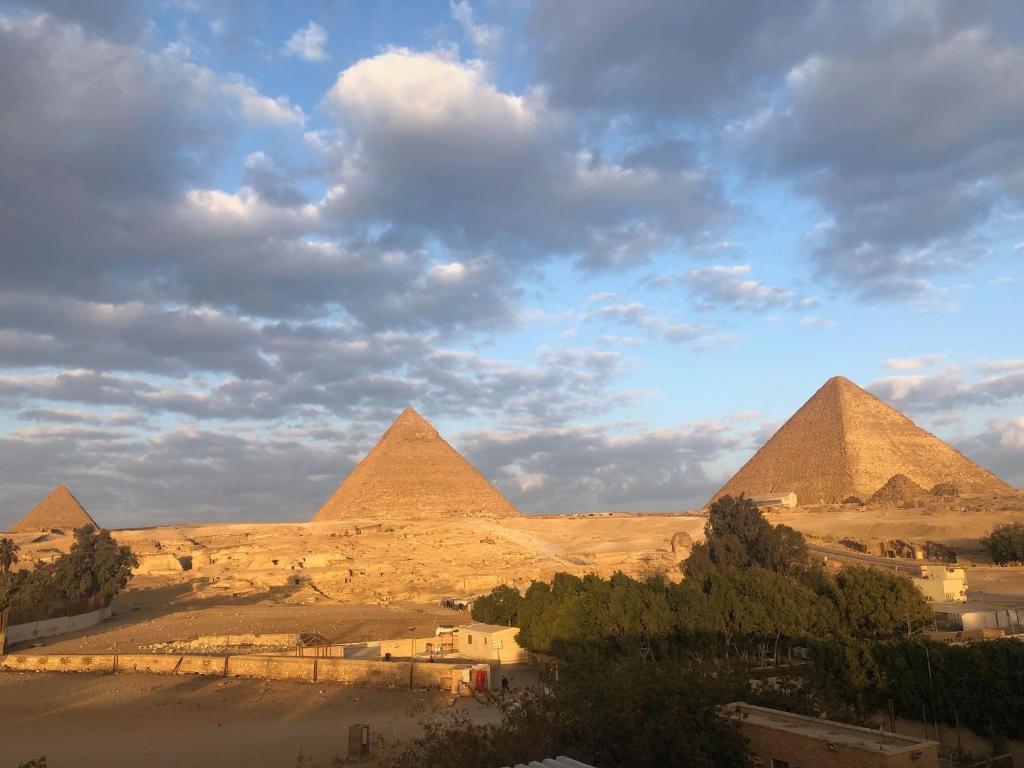Sphinx palace pyramids view - main image