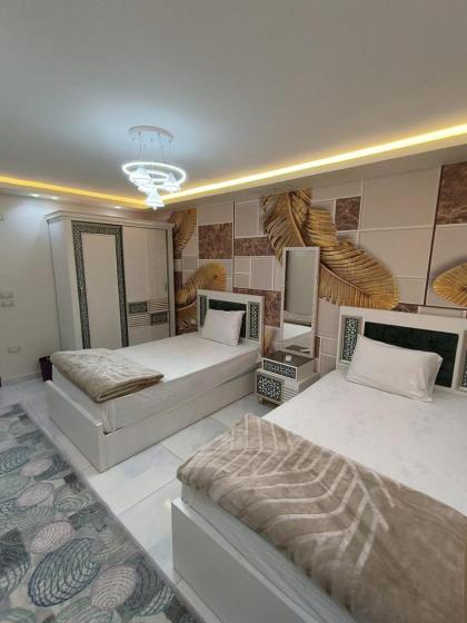 شقة واسعة مريحة بكافة الامكانيات والفرش الحديث في المهندسين قريب من النيل والمتحف وجامعة الدول - image 12
