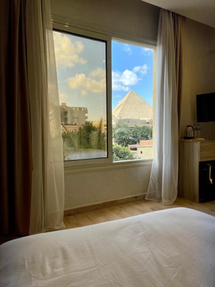 Cleopatra Tower Pyramids View - image 9